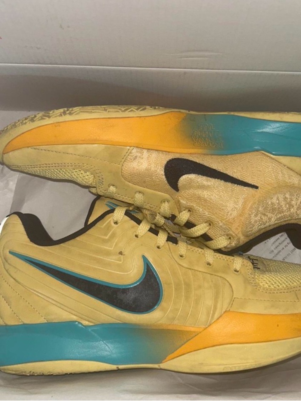 Nike Men’s Yellow Athletic Sneakers with Teal and Black Accents